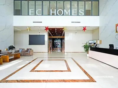 a lobby of an office building with a tv at Spacious 2-Bedroom Apartment Al Furjan-104 in Dubai