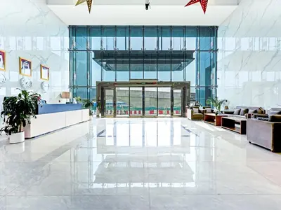 a lobby of a building with a large glass door at Spacious 2-Bedroom Apartment in Al Furjan-1010 in Dubai