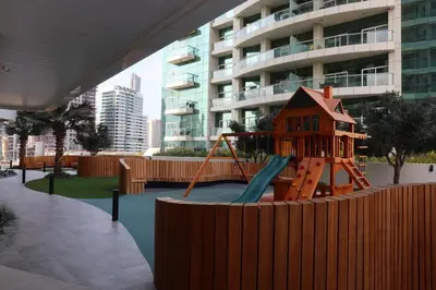 a playground in front of a building with a slide at Premium Luxury 2BR Business Bay - Valet parking, Pool, Gym, SPA and Ice room in Dubai