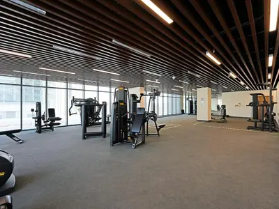a gym with treadmills and equipment in a building at Well-Maintained 2-Bedroom Apartment Al Furjan-207 in Dubai