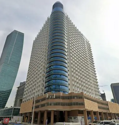 a large building in a city with tall buildings at Extra-Large Studio l AG Tower l Business Bay in Dubai
