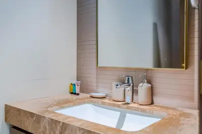a bathroom counter with a sink and a mirror at TRPS - Grand Bleu Tower 2, EMAAR Beachfront - Atlantis & Marina View, Private Beach, Furnished in Dubai