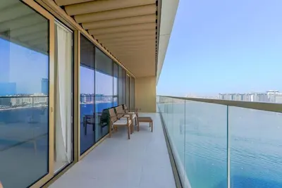 a balcony with a view of the water at TRPS - Grand Bleu Tower 2, EMAAR Beachfront - Atlantis & Marina View, Private Beach, Furnished in Dubai