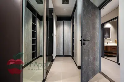 a hallway with a door leading to a bathroom at High Floor With Full Lake View in Dubai
