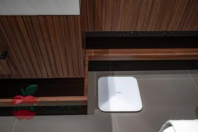 a white appliance sitting in a wooden cabinet at High Floor With Full Lake View in Dubai