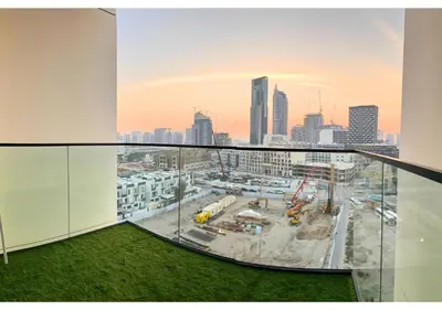 an office with a view of a city at Chic Modern Studio Unit in JVC with 65 inch TV in Dubai