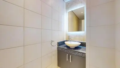 a bathroom with a sink and a mirror at Vacationer l 1 Bed on The Palm l City Views l Near Atlantis in Dubai
