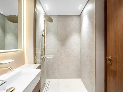 a bathroom with a shower and a sink at Amazing Studio with Balcony and Jacuzzi I Near Dubai Mall & Downtown I Sleeps 4 in Dubai