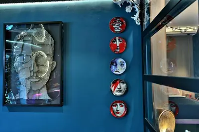 a wall with a bunch of masks on it at The Eden Suite Modern Luxury Meets Cozy Comfort in Dubai