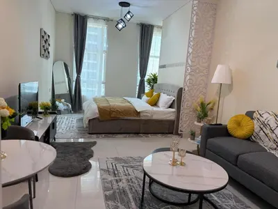 a living room with a couch and a bed at Fully Luxury Studio Total Privacy Pool & Sauna in Dubai