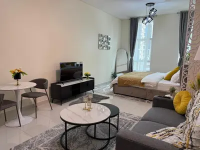 a living room with a couch and a bed at Fully Luxury Studio Total Privacy Pool & Sauna in Dubai