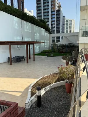 a courtyard in a building with a table and benches at Fully Luxury Studio Total Privacy Pool & Sauna in Dubai