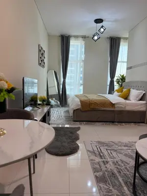 a bedroom with a bed and a living room at Fully Luxury Studio Total Privacy Pool & Sauna in Dubai