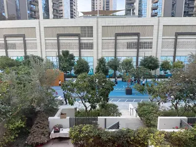 a building with a lot of trees in front of it at 17 Icon Bay Creek Harbour in Dubai