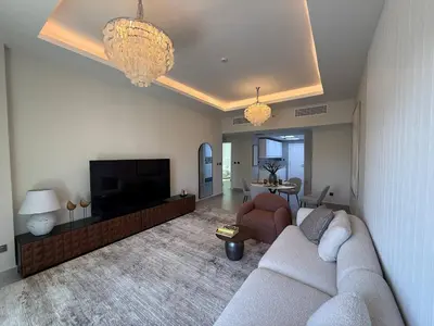 a living room with a couch and a flat screen tv at The Point Tower Dubai Marina in Dubai