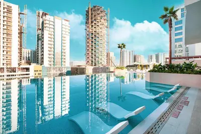 a swimming pool with a view of the city at Iconic Binghatti Royale! Private Pool in Your Balcony! 5 Star Amenities! in Dubai