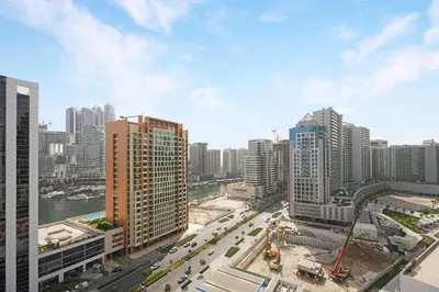 an aerial view of a city with tall buildings at GuestReady - Prime Location | Studio Canal View in Dubai
