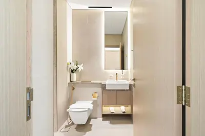 a bathroom with a toilet and a sink at New Luxury 1BR with Private Pool & Balcony in JVC in Dubai
