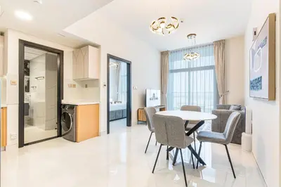 a kitchen and dining room with a table and chairs at Brand New Home with Amazing Facilities in Dubai