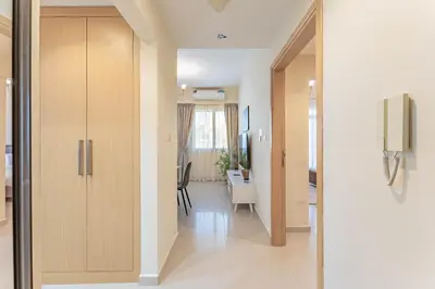 a hallway leading to a living room and a dining room at HAVN - 1 bed in May Residence, JVC in Dubai