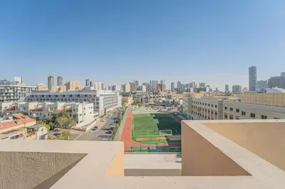a view of a city with buildings and a street at HAVN - 1 bed in May Residence, JVC in Dubai