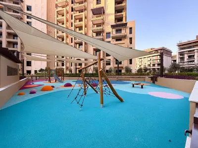 a playground with a slide in a city at GuestReady - 1 BHK | Serene 9th-Floor Escape in Dubai