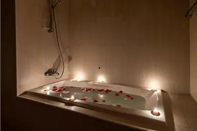 a bath tub with lights in a bathroom at JBR Al Bateen Residences By Luxe Living Collection - Private Beach and Sea Views in Dubai
