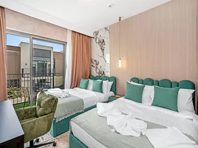 a hotel room with two beds and a balcony at 4BR Villa in Resort-Style Gated Community with Lazy River in Arabian Ranches 3 in Dubai