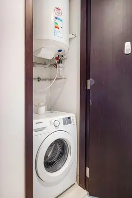 a washer and dryer in a small room at Stunning Burj & Fountain View Downtown 29 Blvd in Dubai