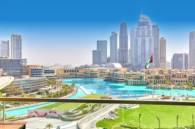a view of a city skyline with a large pool at GRaNDE 2BR Best BURJ Khalifa & Fountain, Next to DXB Mall in Dubai