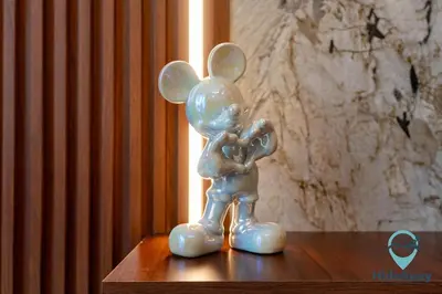 a figurine of a mouse standing on a table at Stunning 1BR l Creek Crescent Suite in Dubai