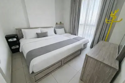 a bedroom with a large bed and a window at 1BR, Afnan 2, Midtown, Dubai Production City in Dubai