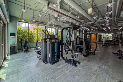 a gym with several treadmills and exercise bikes at Mag318 downtown Luxury-5 Minutes walk to Burj&mall in Dubai