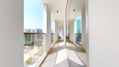 an apartment balcony with a view of a city at Modern 2BR City Skyline View 6 in Dubai