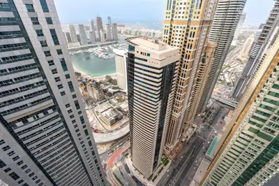 an aerial view of a city with tall buildings at 2BR, Seaside Serenity, Sea View - Torch Tower, Dubai Marina by Deluxe Holiday Homes in Dubai