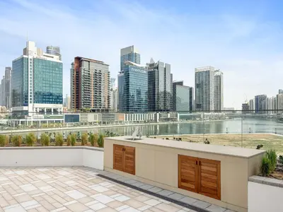 a view of a city skyline with tall buildings at VayK - Luxury 1 BD with Panoramic Canal Views in Dubai
