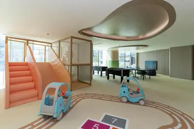 a childs room with a slide and a toy car at Serene 1BR Retreat W Private Pool Binghatti Royale in Dubai