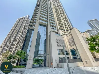 a large building with two tall buildings at Vogue Downtown Act One near Burj Khalifa and Dubai Mall, Two Bedroom Apartment with Balcony and City Skyline View, Access to all Amenities in Dubai