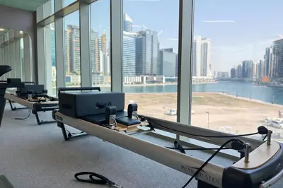 a row of beds in a room with a large window at Luxury 1 Bedroom - Burj Khalifa & sea view - Sauna & Pool - High Floor in Dubai