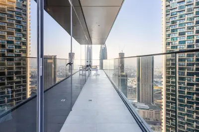 a glass walkway in the middle of a skyscraper at 3br on the 49th floor of Address Opera in Dubai