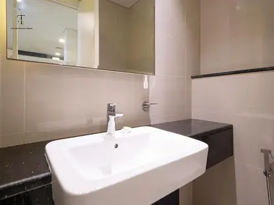 a bathroom with a white sink and a mirror at Golden Grove 1 Bhk Bays Edge 1 Business bay in Dubai
