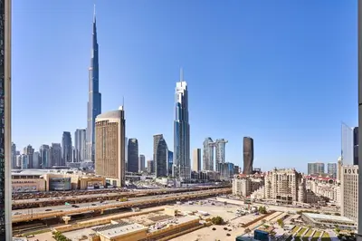 a view of a large city with a tall skyscraper at Frank Porter - Downtown Views II in Dubai