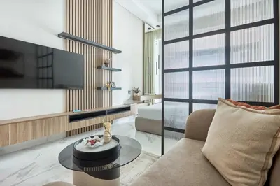 a living room with a couch and a tv at Frank Porter - J One Tower, Business Bay in Dubai