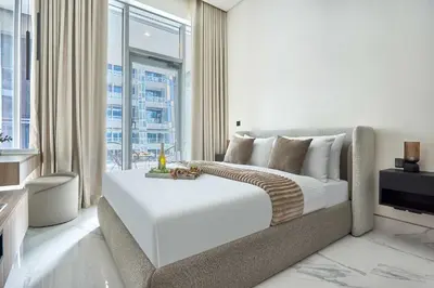 a bedroom with a bed and a large window at Frank Porter - J One Tower, Business Bay in Dubai