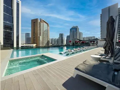 a swimming pool on the roof of a building at Panoramic View Dubai Mall 8 min walk Infinity pool in Dubai