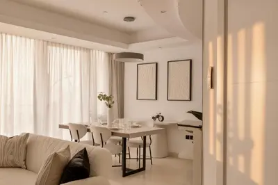 a living room with a table and a couch at Stunning 2 Bedroom Apartment in Dubai Marina in Dubai