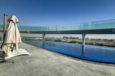 a pool on the roof of a building at High-Floor Studio with Views of Miracle Garden and Community, Near Dubai Top Attractions, Skyz by Danube, Arjan by Deluxe Holiday Homes in Dubai