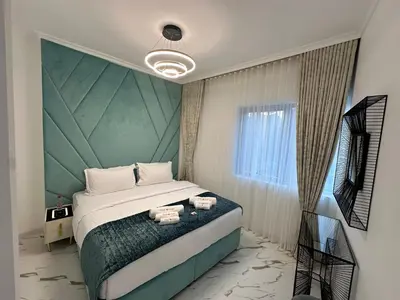 a bedroom with a large bed and a window at Premium 2BR Marina View Apartment in Dubai Marina in Dubai