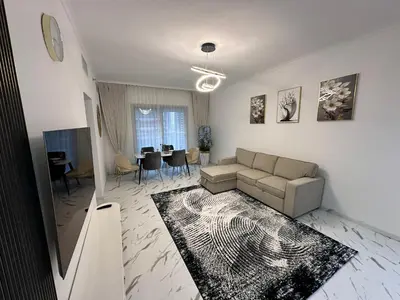 a living room with a couch and a table at Premium 2BR Marina View Apartment in Dubai Marina in Dubai