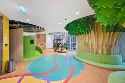 a childrens play room with a train on the wall at Luxury Urban Living at Imperial Avenue, Downtown in Dubai